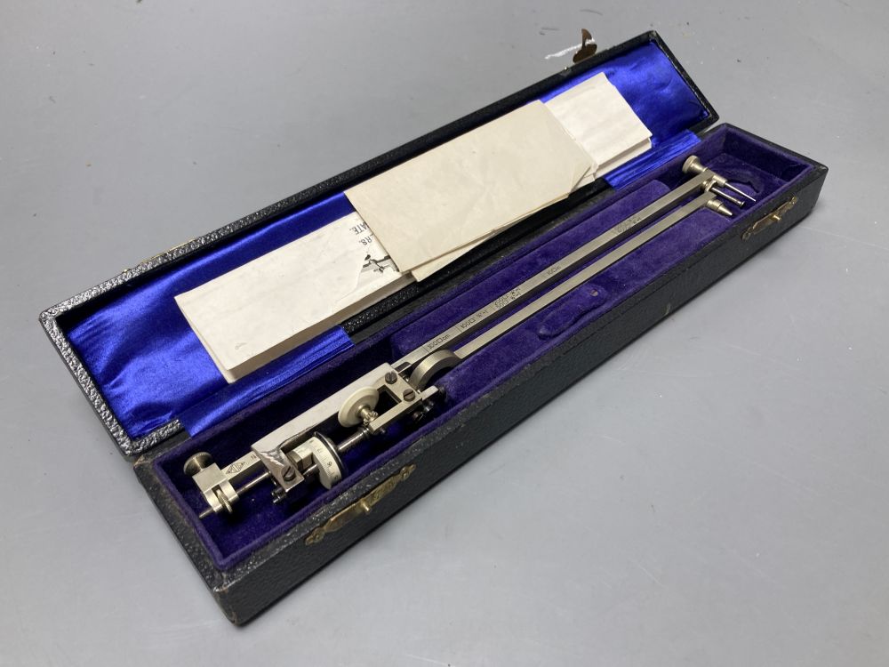 A vintage polished steel planimeter by M.D.S, cased with illustrations